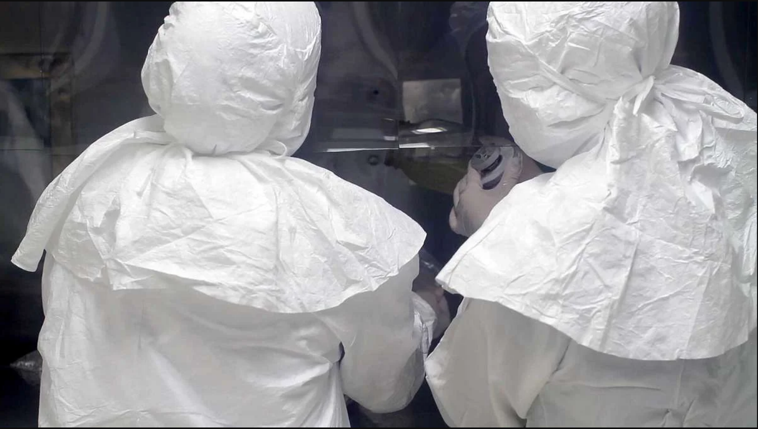 Lab workers in White protective wear